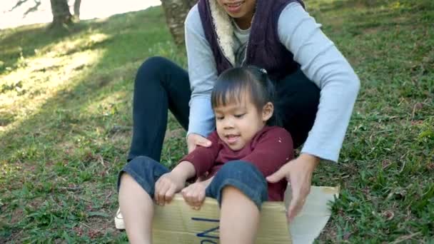 Cute Little Child Girl Having Fun Playing Slide Recycled Cardboard — Stock Video