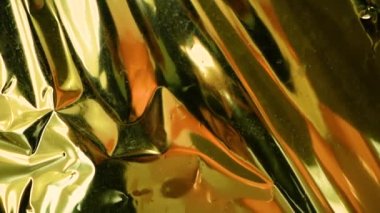 Wrinkled light gold background. Abstract texture.