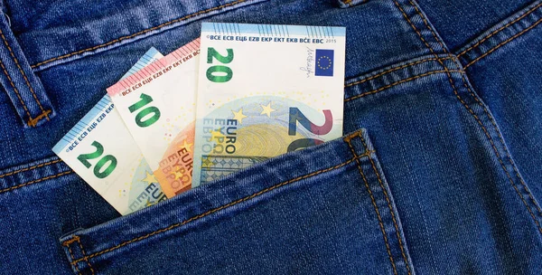 Money in the pocket of jeans. Euro currency