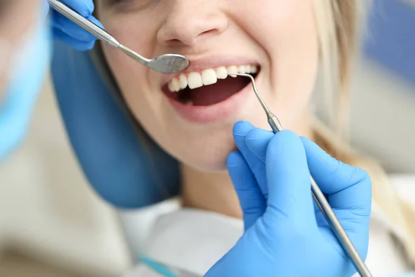 Closeup of face of female who undergo detntist checkup. — Stock Photo, Image