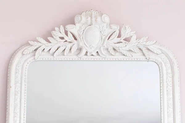 Close-up of a vintage mirror with decorative ornaments Stock Picture