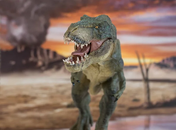 Portrait of walking and dangerous tyrannosaurus rex with erupting volcano in the background. — 스톡 사진