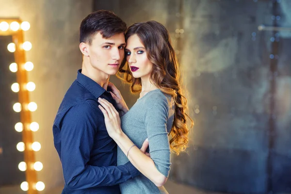 Young Handsome Man Hugging His Beautiful Woman Standing Room Mirror — Stock Photo, Image