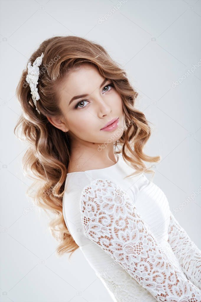 fashion portrait of young beautiful woman in white wedding dress 