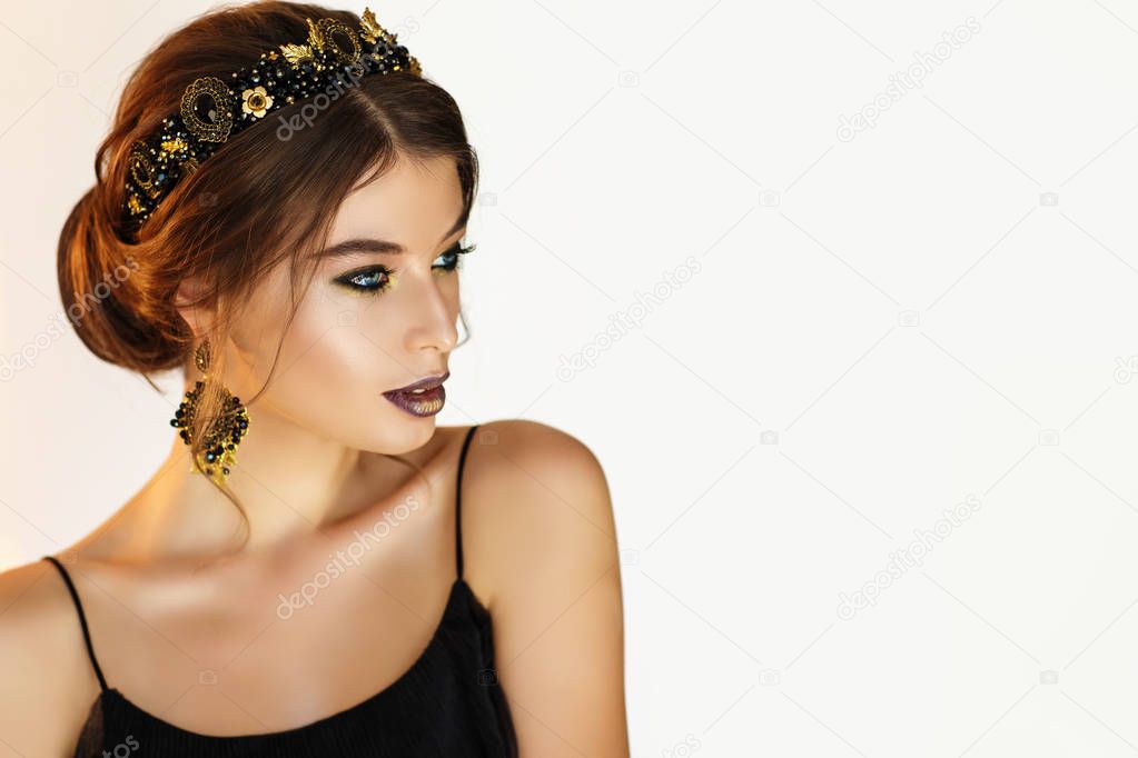 Portrait of gorgeous young woman in beautiful earrings 