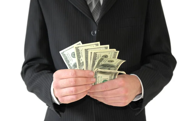 Man in black business suit, holding cash in hands — Stock Photo, Image