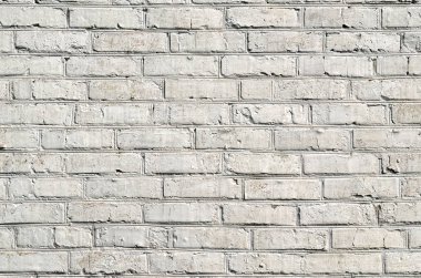 Beyaz boya ile boyanmış bir tuğla duvar dokusu.
