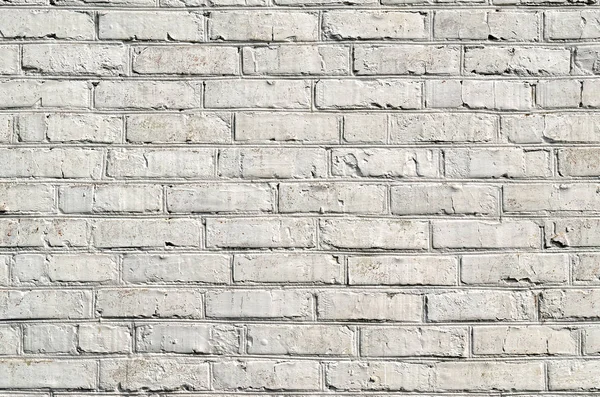 Beyaz boya ile boyanmış bir tuğla duvar dokusu.