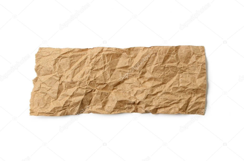 A sheet of brown, crumpled paper, on a white background.