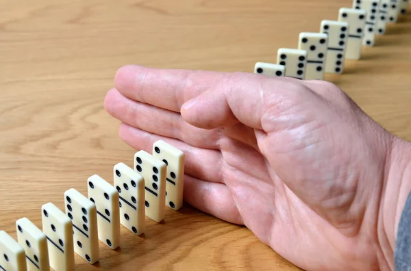 Domino Effect Chain Reaction Stopped Human Hand — Stock Photo, Image