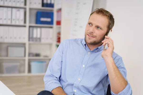 Thoughtful businessman listening to a conversation — Stock Photo, Image