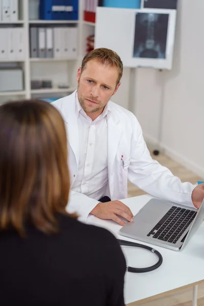 Attentive male doctor with a serious expression — Stock Photo, Image