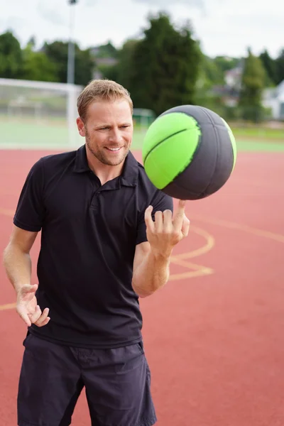 Skilled sports coach spinning a ball — ストック写真