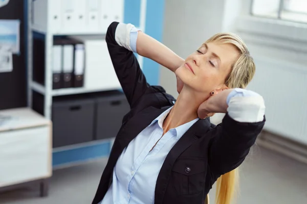 Stressed young businesswoman de-stressing — Stock Photo, Image