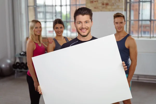 Person holding large blank white poster — Stockfoto