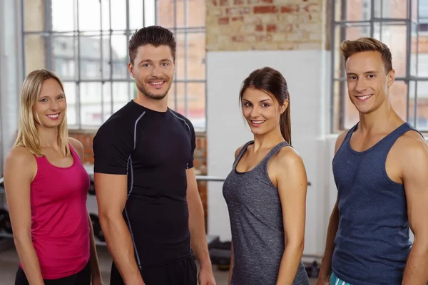 Confident group of young adults at gym — Stock Photo, Image