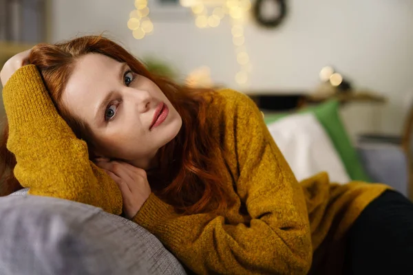 Thoughtful young woman relaxing at home — Stock Photo, Image