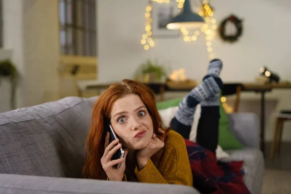 Irritated woman talking by phone — Stock Photo, Image