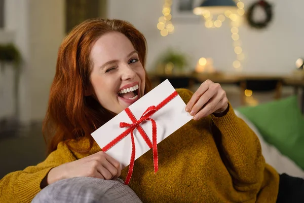 Laughing woman holding envelope — Stock Photo, Image