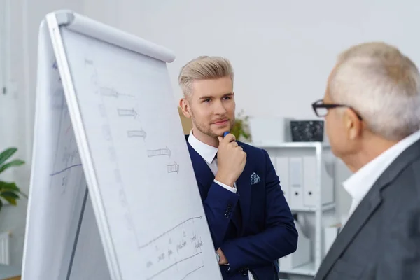 Stylish trendy businessman talking to a colleague — Stock Photo, Image