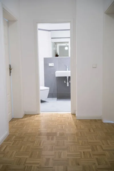 Bathroom through opened door — Stock Photo, Image