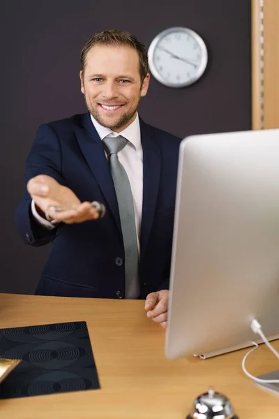 Smiling hotel manager — Stockfoto