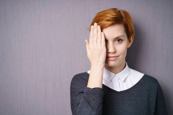 Woman covering one eye — Stock Photo, Image