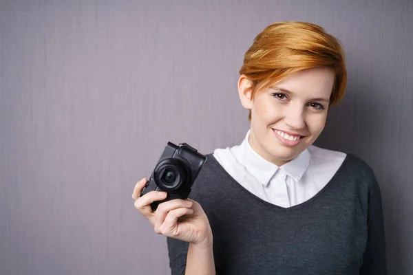 Pretty woman with camera — Stock Photo, Image