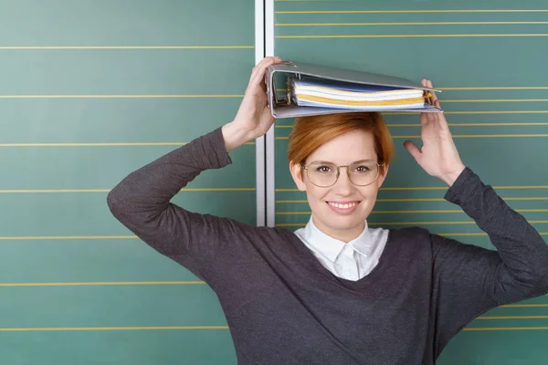 Teacher with book on head — Stock Photo, Image