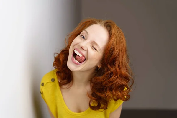 Young woman winking — Stock Photo, Image
