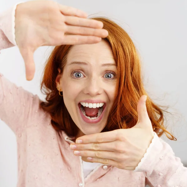 Woman with frame gesture — Stock Photo, Image