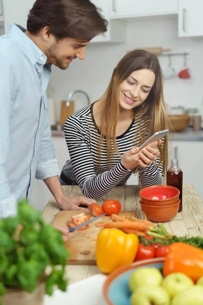 Young couple checking a text message — Stock Photo, Image