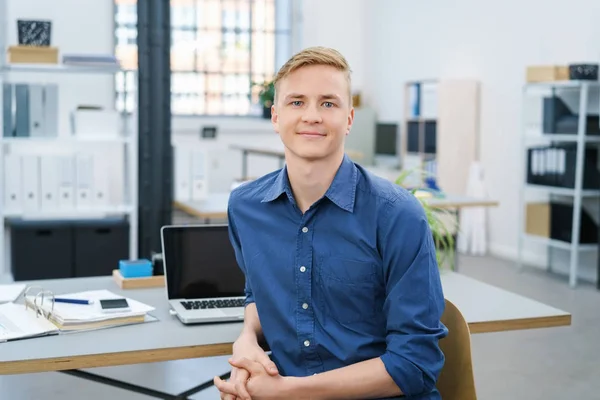Friendly relaxed young businessman in the office — Stock Photo, Image