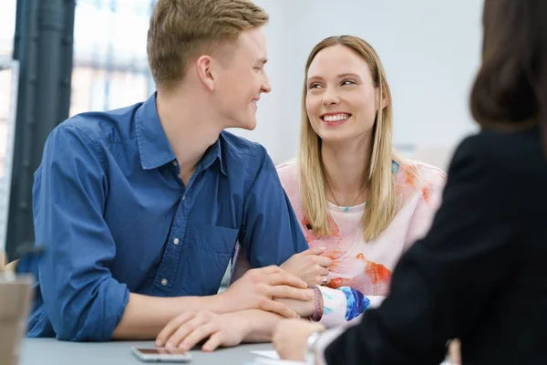 Young married couple in a business meeting — Stock Photo, Image