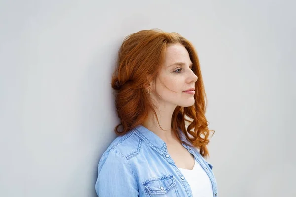 Thoughtful calm young redhead woman — Stock Photo, Image