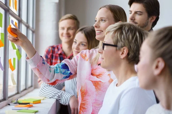 Happy office team meeting with sticky notes — Stok Foto