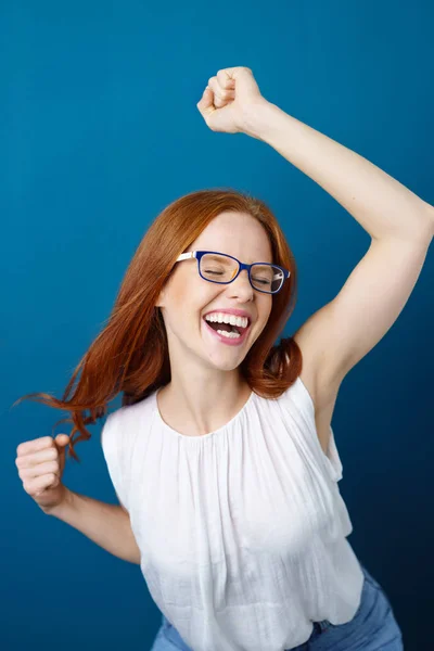 Vivacious young woman dancing with happiness — Stock Photo, Image