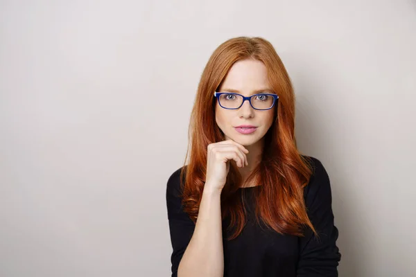 Thoughtful intense young redhead woman — Stock Photo, Image