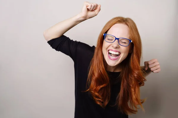 Vivacious excited young woman cheering — Stock Photo, Image