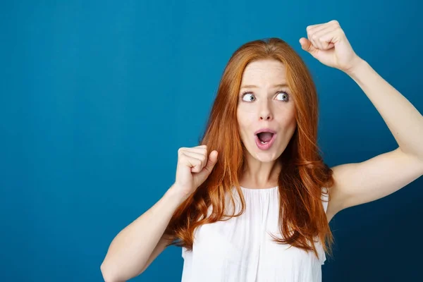 Exuberant young woman cheering — Stock Photo, Image