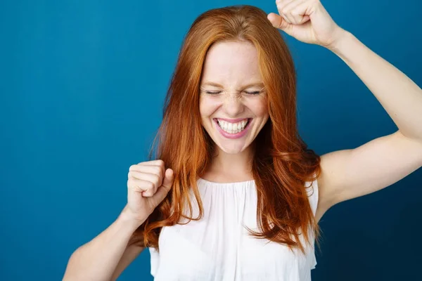 Young woman celebrating a victory — Stock Photo, Image