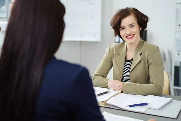 Smiling pleased young businesswoman — Stock Photo, Image