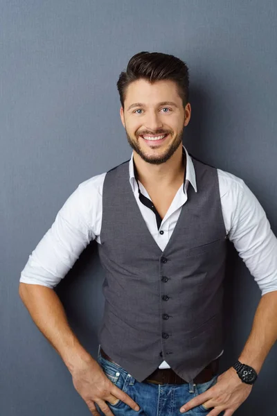 Portrait of young smiling man wearing vest — Stock Photo, Image