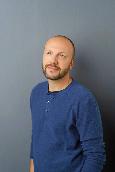 Middle-aged man standing thinking — Stock Photo, Image