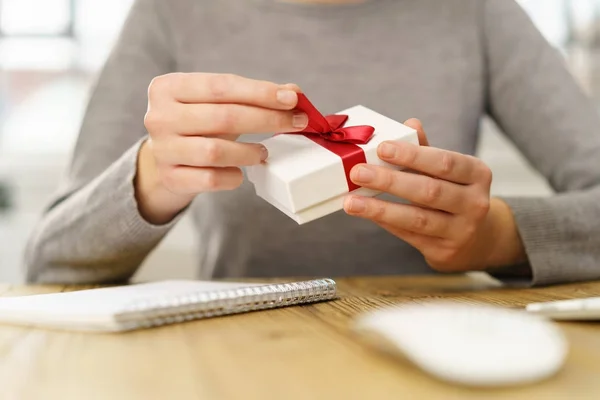 Businesswoman Unwrapping Small Gift Box Tied Red Ribbon Close Low — Stock Photo, Image