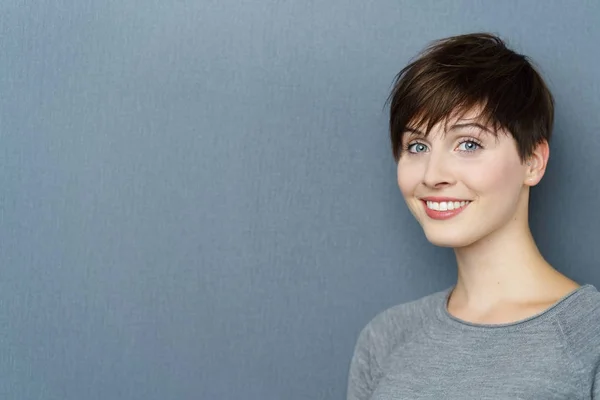 Attractive young woman with short brown hair — Stock Photo, Image
