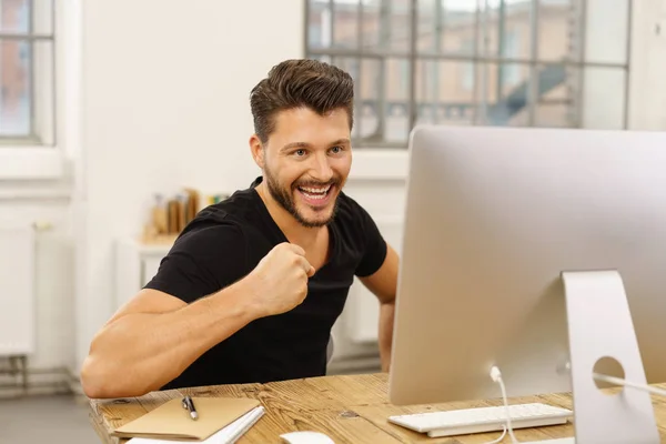 Jubilant man punching air — Stock Photo, Image