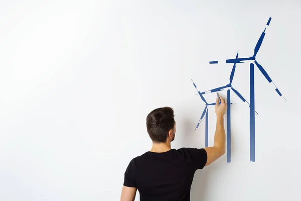 Engineer drawing wind turbines — Stock Photo, Image