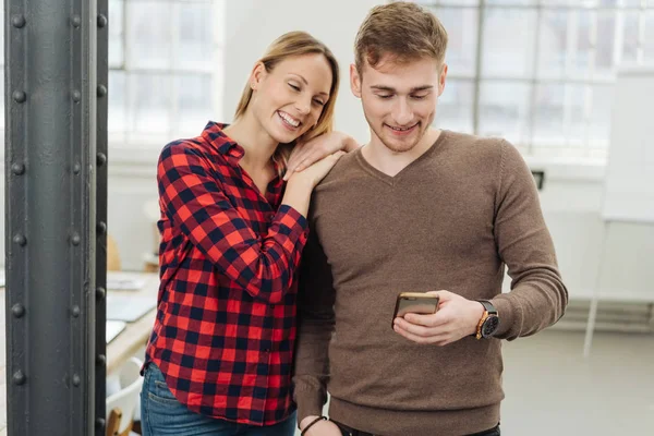 Affectionate Young Couple Looking Text Message Smartphone — Stock Photo, Image