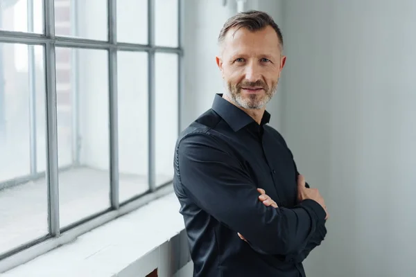 Middle Aged Man Standing Folded Arms Leaning Windowsill Turning Look — Stock Photo, Image